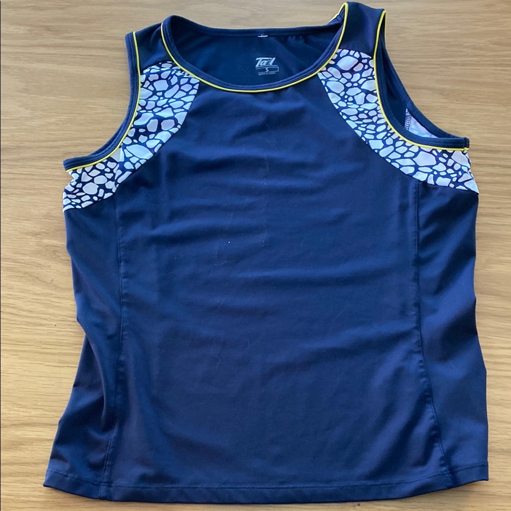 Tennis top in navy with white and yellow detail.